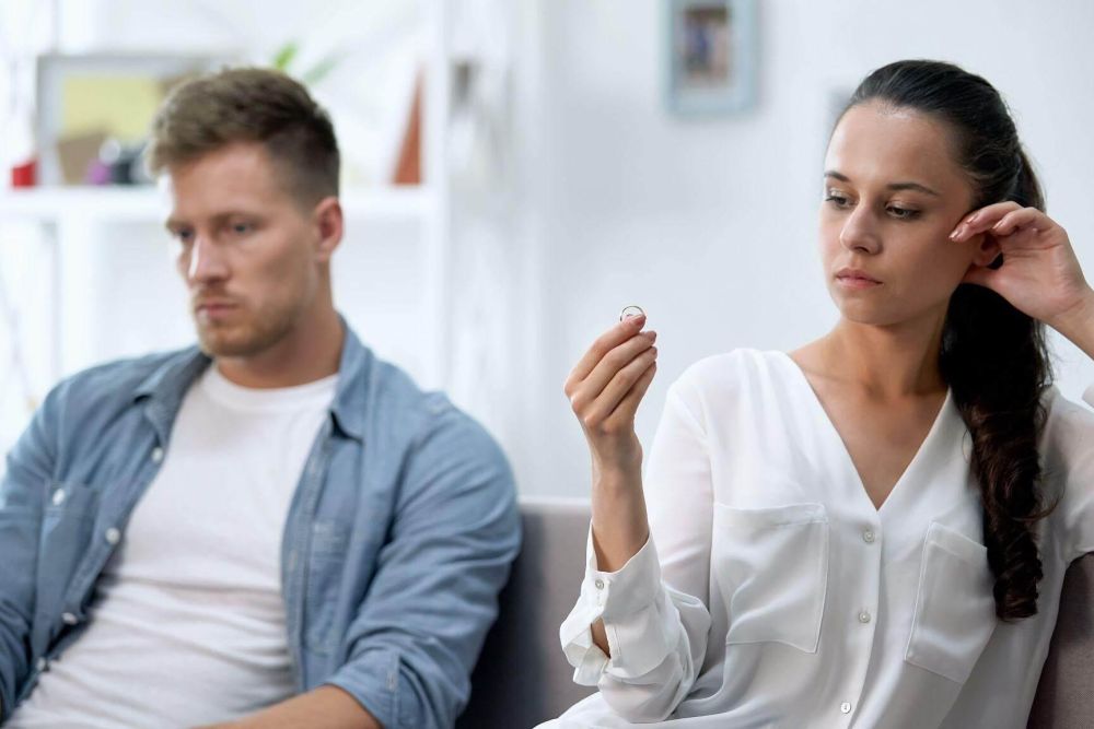 A couple, a man and a woman, sitting