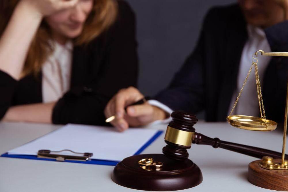 a judge and a woman sitting at a table
