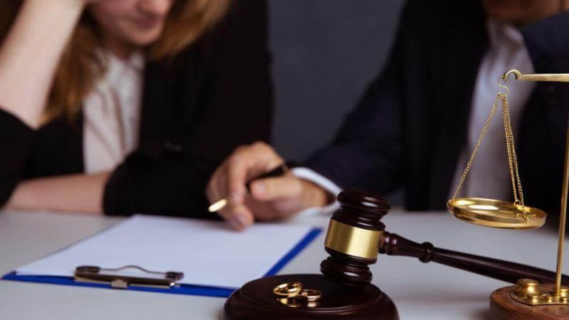 a judge and a woman sitting at a table