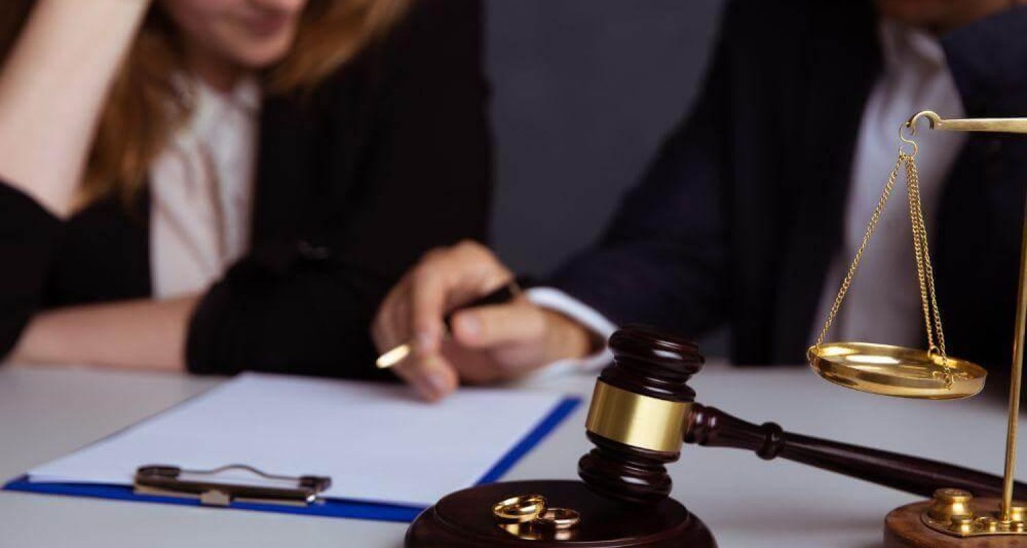 a judge and a woman sitting at a table