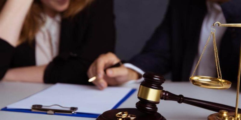 a judge and a woman sitting at a table