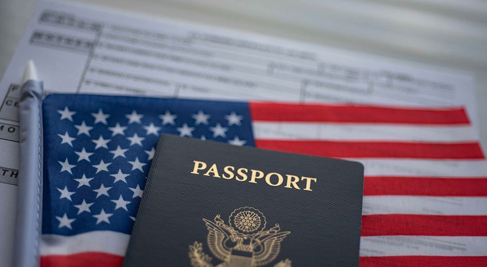 The American flag with a passport on top of it represnting immigration rights in America