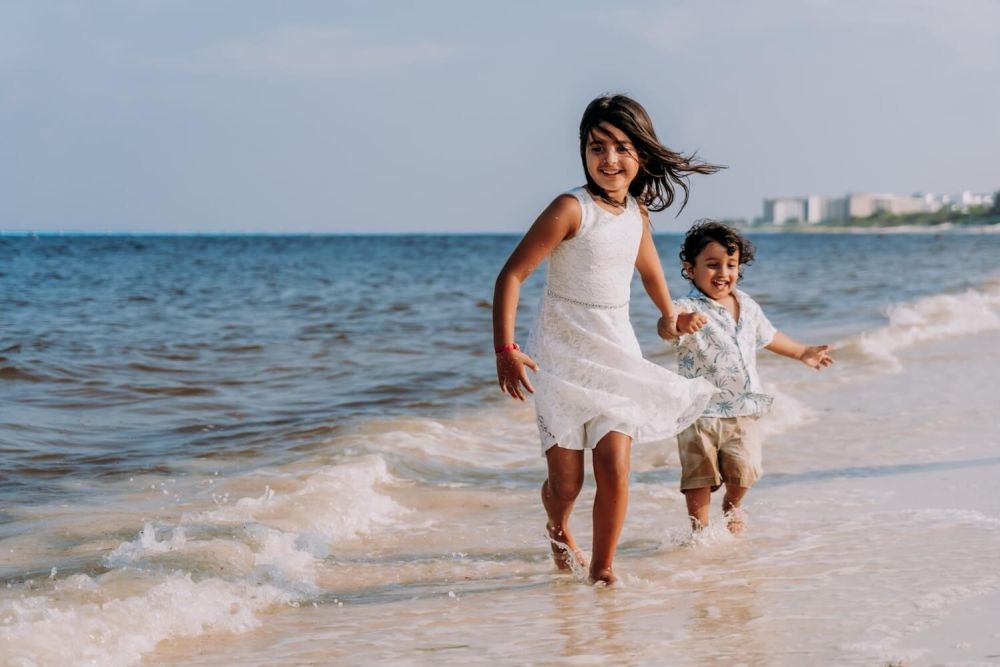two children playing on beach