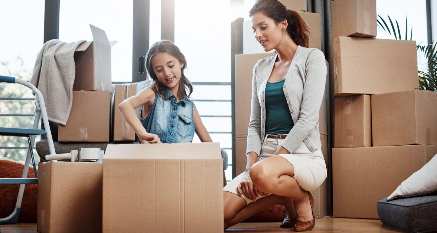 Child Helping a mother pack up for a move