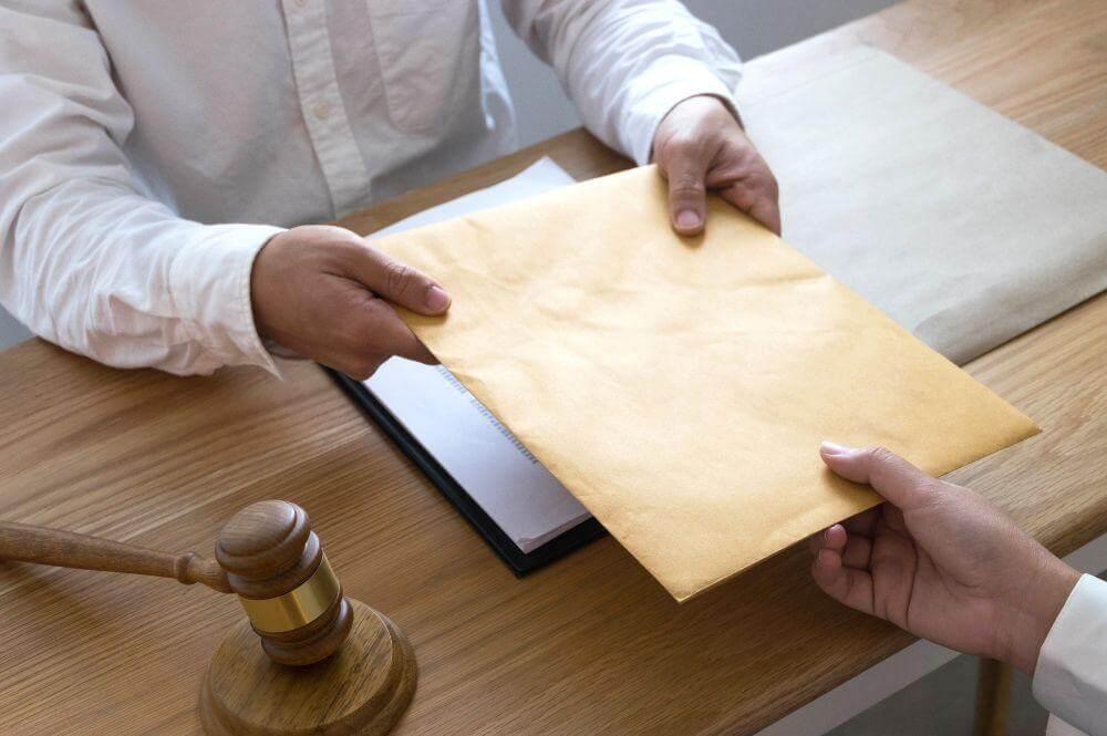 Two people reviewing papers with a judge